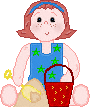 Cute Little Redhead Girl with Shovel and Pail Playing in Sand